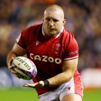 Wales\' Dillon Lewis carries the ball during his team\'s Six Nations match against Scotland in Edinburgh on Feb. 11. | REUTERS