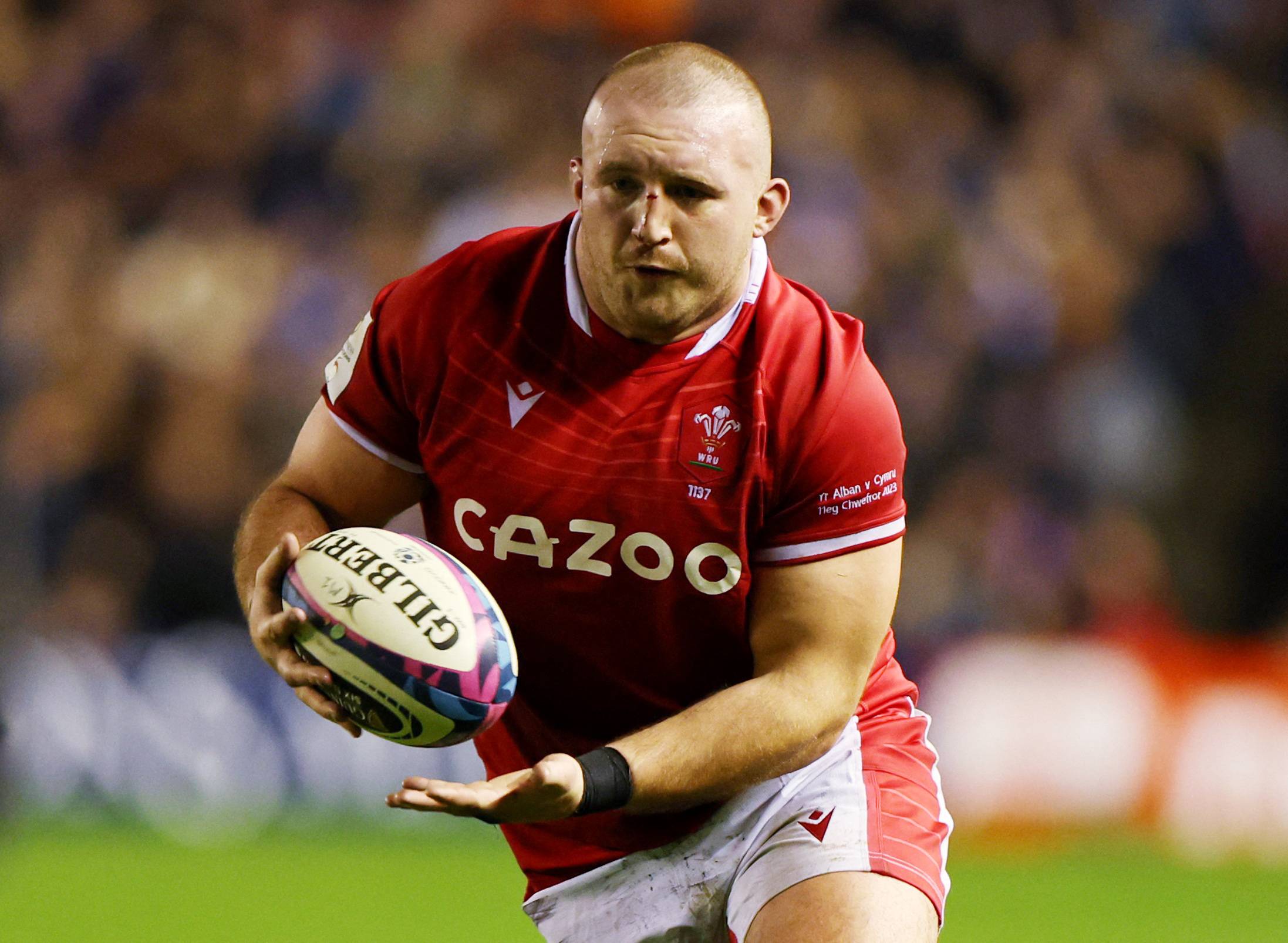 Wales' Dillon Lewis carries the ball during his team's Six Nations match against Scotland in Edinburgh on Feb. 11. | REUTERS