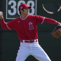 The Angels\' Shohei Ohtani warms up during spring training in Tempe, Arizona, on Thursday. | USA TODAY