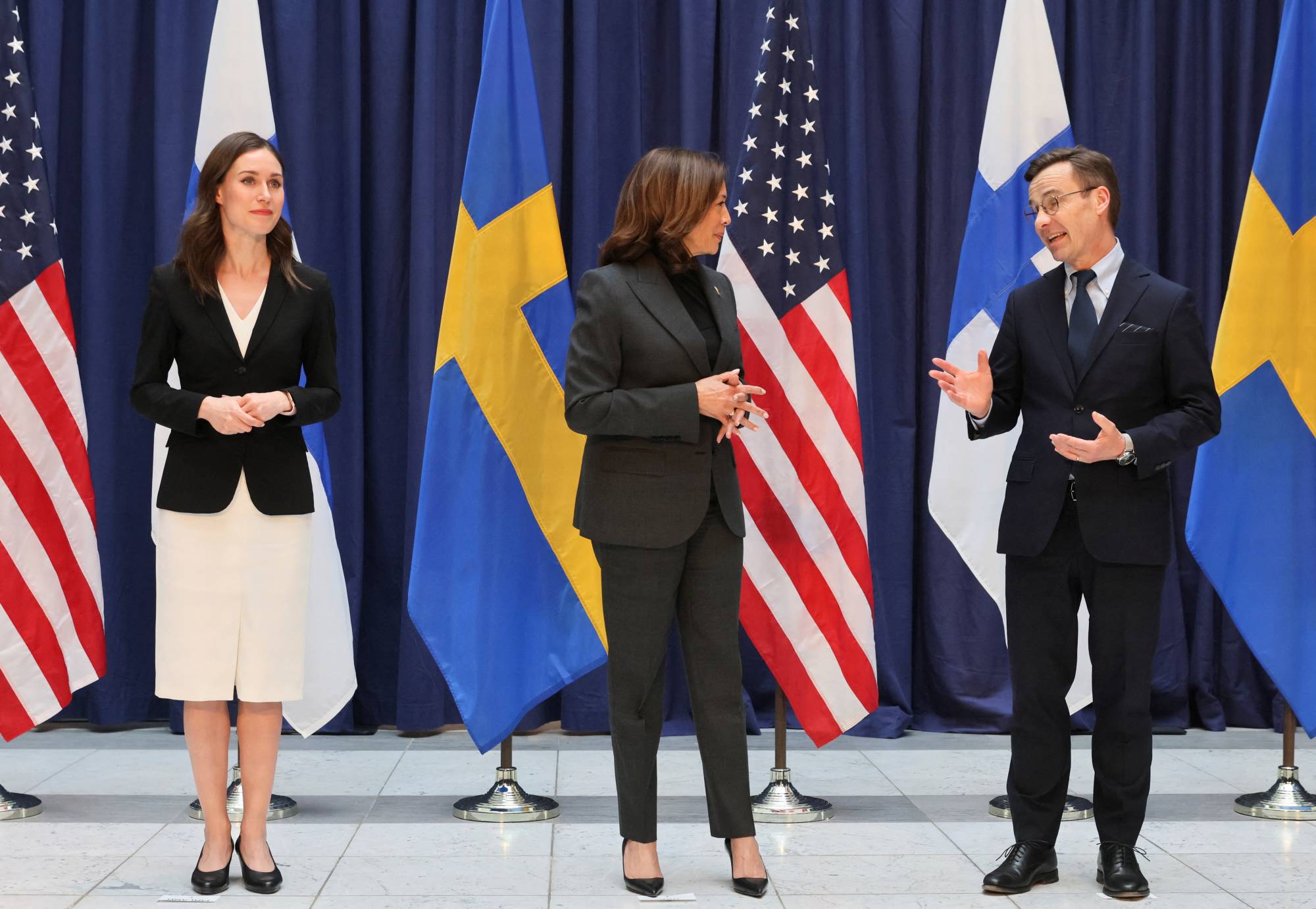 U.S. Vice President Kamala Harris speaks with Finland Prime Minister Sanna Marin and Swedish Prime Minister Ulf Kristersson during the Munich Security Conference on Feb. 18. | Reuters