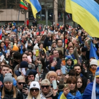 People gather to show their support for Ukraine on the first anniversary of the Russian invasion in Brussels on Feb. 25.  | REUTERS