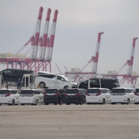 Toyota vehicles bound for shipment at a port in Yokohama | BLOOMBERG