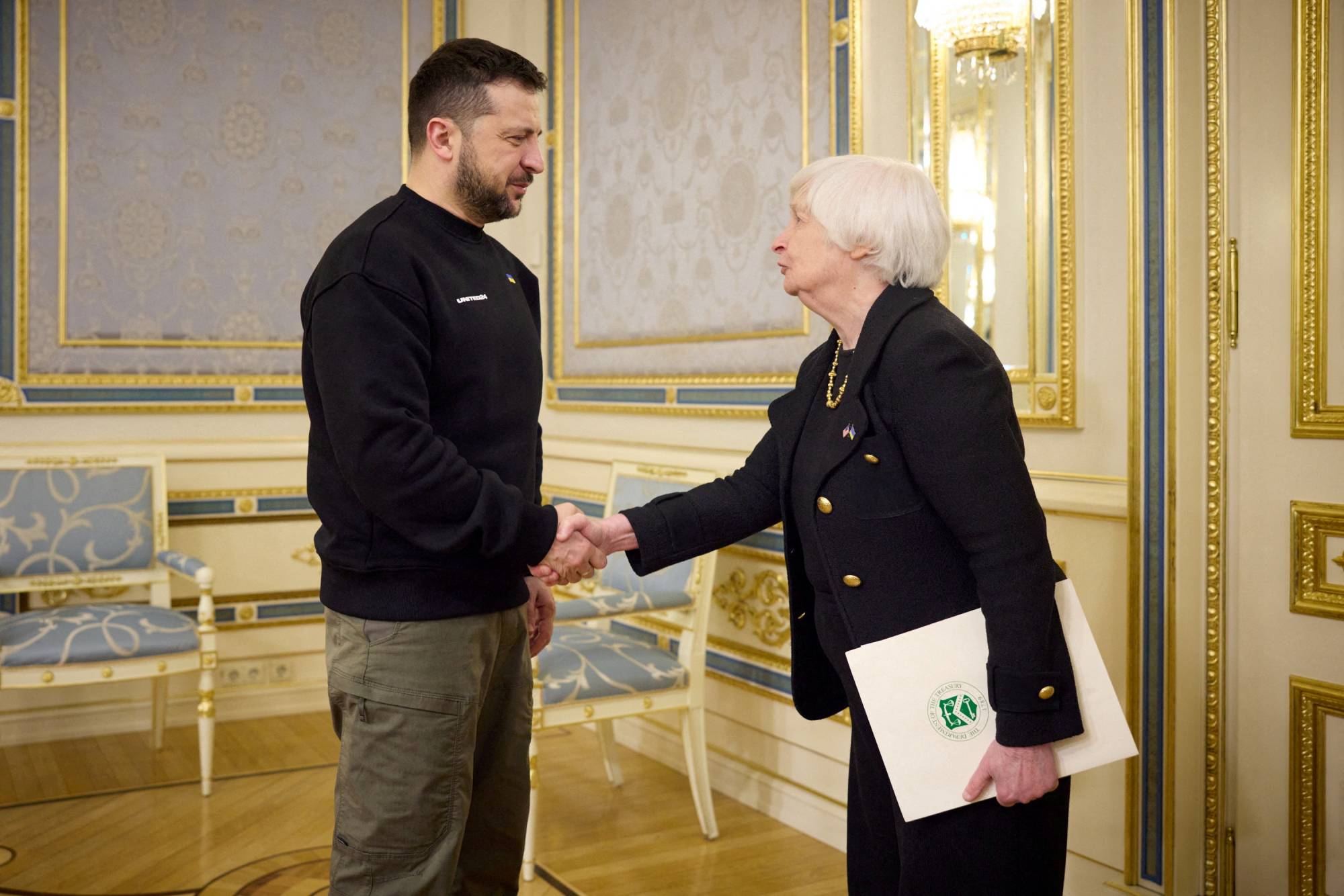 Ukrainian President Volodymyr Zelenskyy welcomes Yellen in Kyiv on Monday. | Ukrainian Presidential Press Service / via REUTERS 