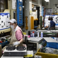 Japan\'s factory output shrank at the fastest pace in eight months in January while retail sales rose. | BLOOMBERG