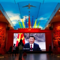 An image of Chinese leader Xi Jinping is displayed at the Military Museum of the Chinese People\'s Revolution in Beijing. An expanding nuclear partnership between Russia and China is having a huge impact on nonproliferation efforts. | REUTERS 