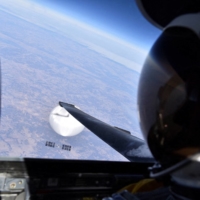 A U.S. Air Force U-2 high-altitude reconnaissance plane flies by a suspected Chinese surveillance balloon as it hovers over the central continental United States on Feb. 3. 
  | U.S. AIR FORCE / DEPARTMENT OF DEFENSE / VIA REUTERS 