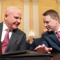 Former U.S. national security adviser H.R. McMaster (left) and former Deputy national security adviser Matthew Pottinger speak prior to their testimony during a House Select Committee on the Chinese Communist Party hearing in Washington on Tuesday. | REUTERS
