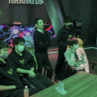 Staff watch as students compete in a video game tournament at Japan\'s first esports high school. | CHANG W. LEE / THE NEW YORK TIMES 