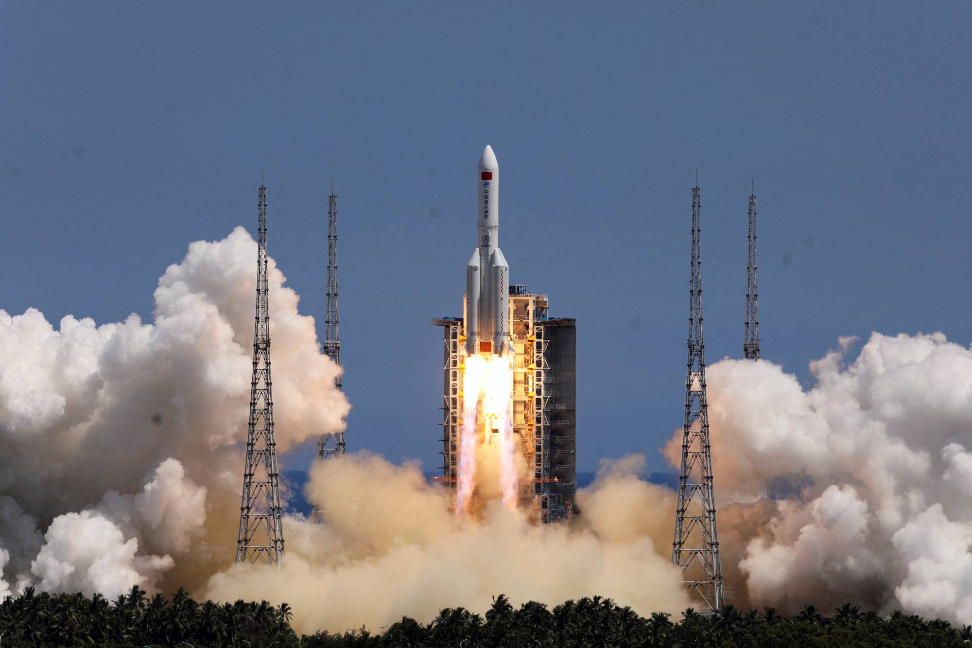 A rocket carrying a lab module for China's space station takes off from Hainan province in July. | CHINA DAILY / VIA REUTERS
