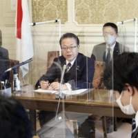 Hiroshige Seko, the Liberal Democratic Party’s Upper House secretary-general (center), speaks at a news conference in Tokyo last month.  | KYODO