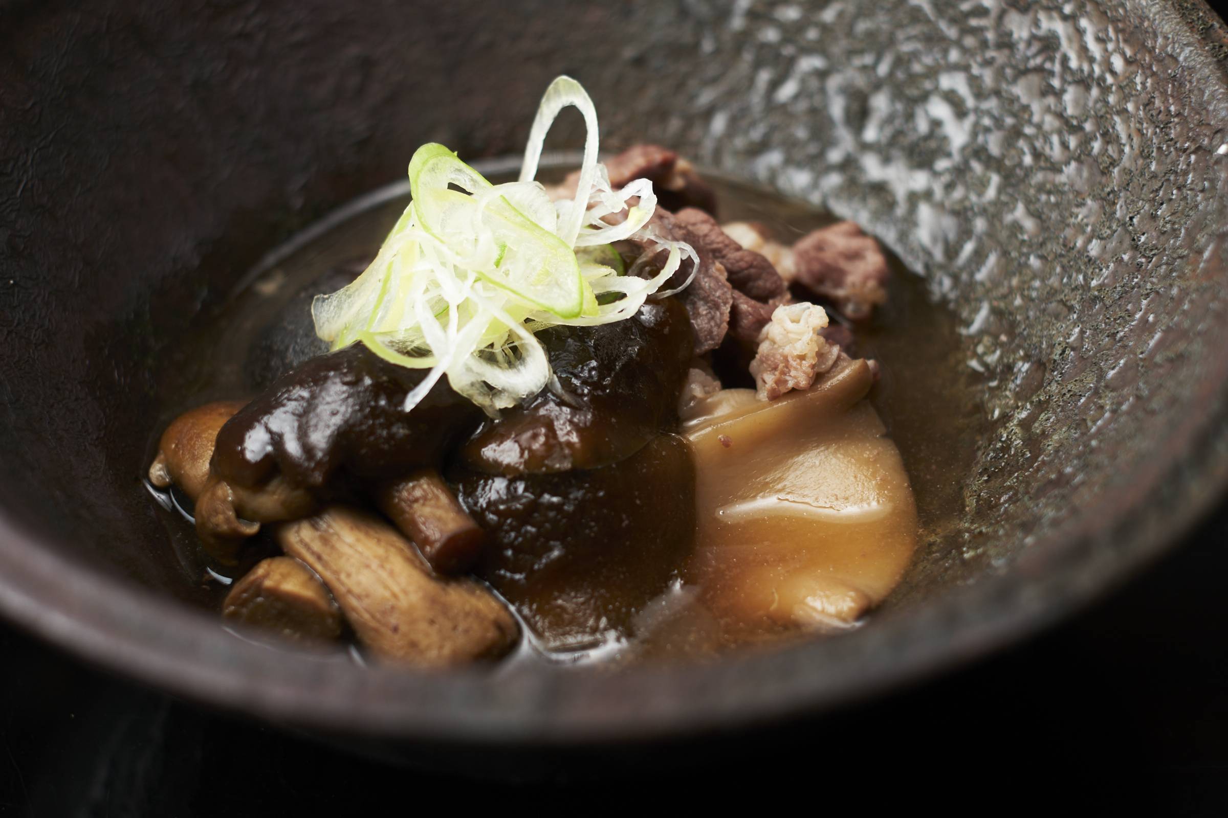 At Dewaya, bear meat is simmered in a nabe (hotpot) with a mix of foraged fungi to imbue extra umami. | KOUTAROU WASHIZAKI 