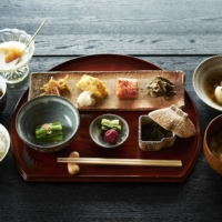 Sansai and other wild foods are also featured in the traditional Japanese breakfast served to overnight guests at Dewaya. | KOUTAROU WASHIZAKI
