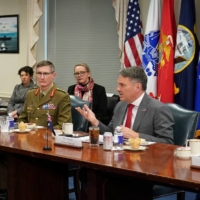 Australian Defense Minister Richard Marles gestures toward U.S. Defense Secretary Lloyd Austin during their trilateral meeting with British Defense Secretary Ben Wallace at the Pentagon in Washington in December 2022. | REUTERS
