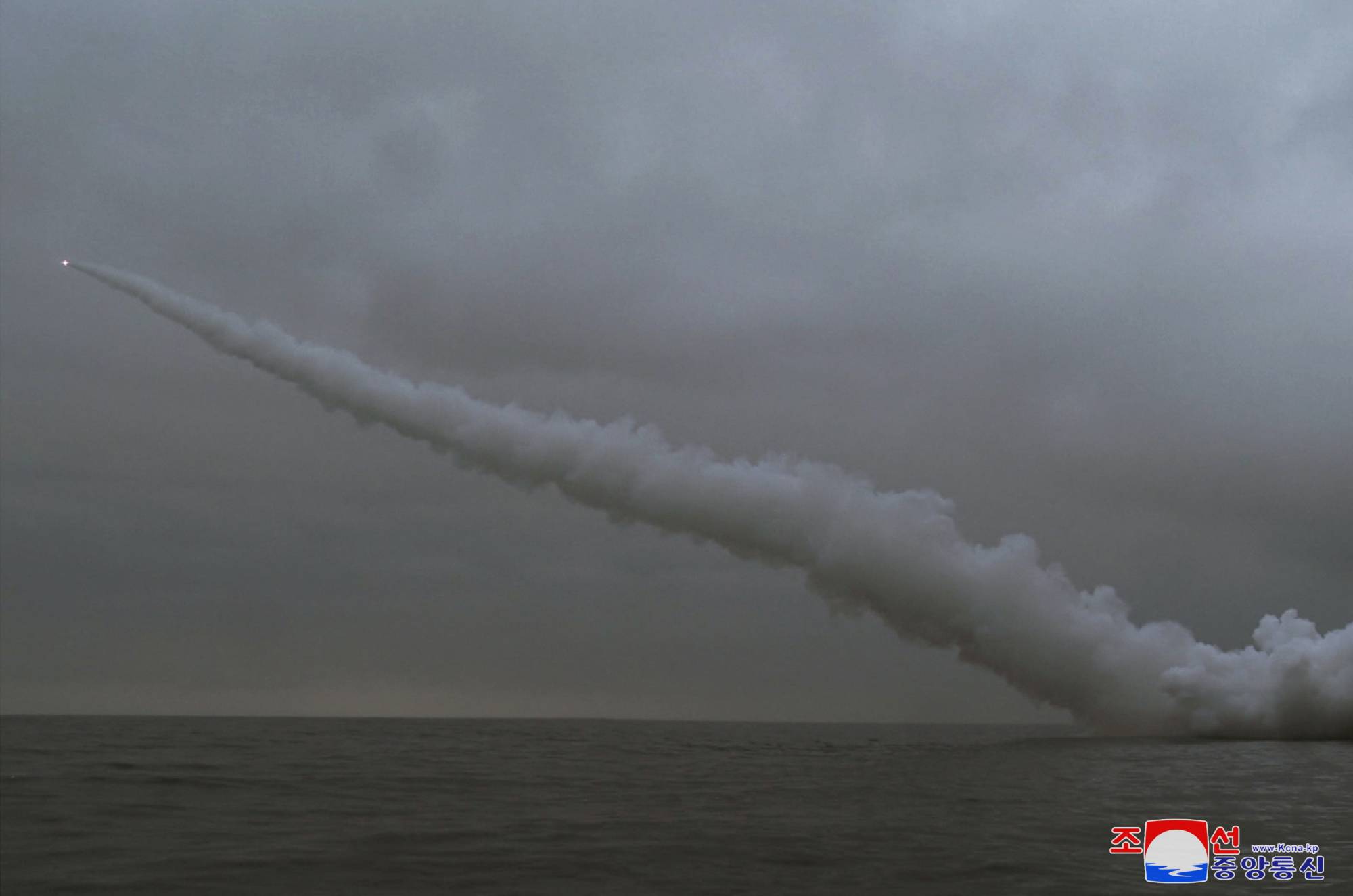 North Korea fires a 'strategic cruise missile' from a submarine at an undisclosed location on Sunday. | KCNA / VIA REUTERS    