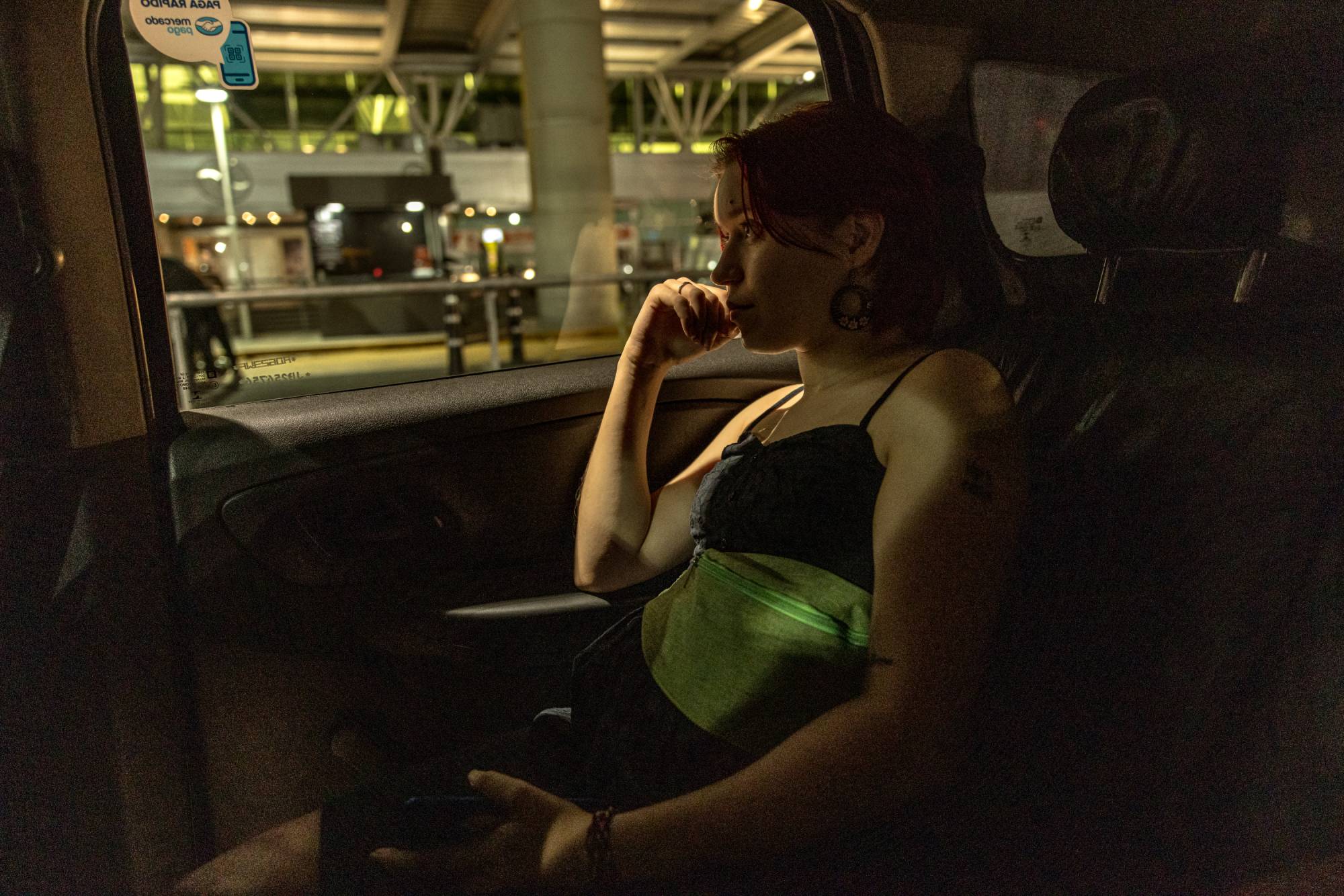 Konovalova arrives at the airport in Buenos Aires to pick up her husband on Feb. 24. | Sarah Pabst / The New York Times