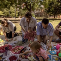 Maria Rashka, her husband Pavel Kostomarov and their daughter Alexandra, who was born in August, celebrate their wedding with friends at a park in Buenos Aires. | SARAH PABST / THE NEW YORK TIMES