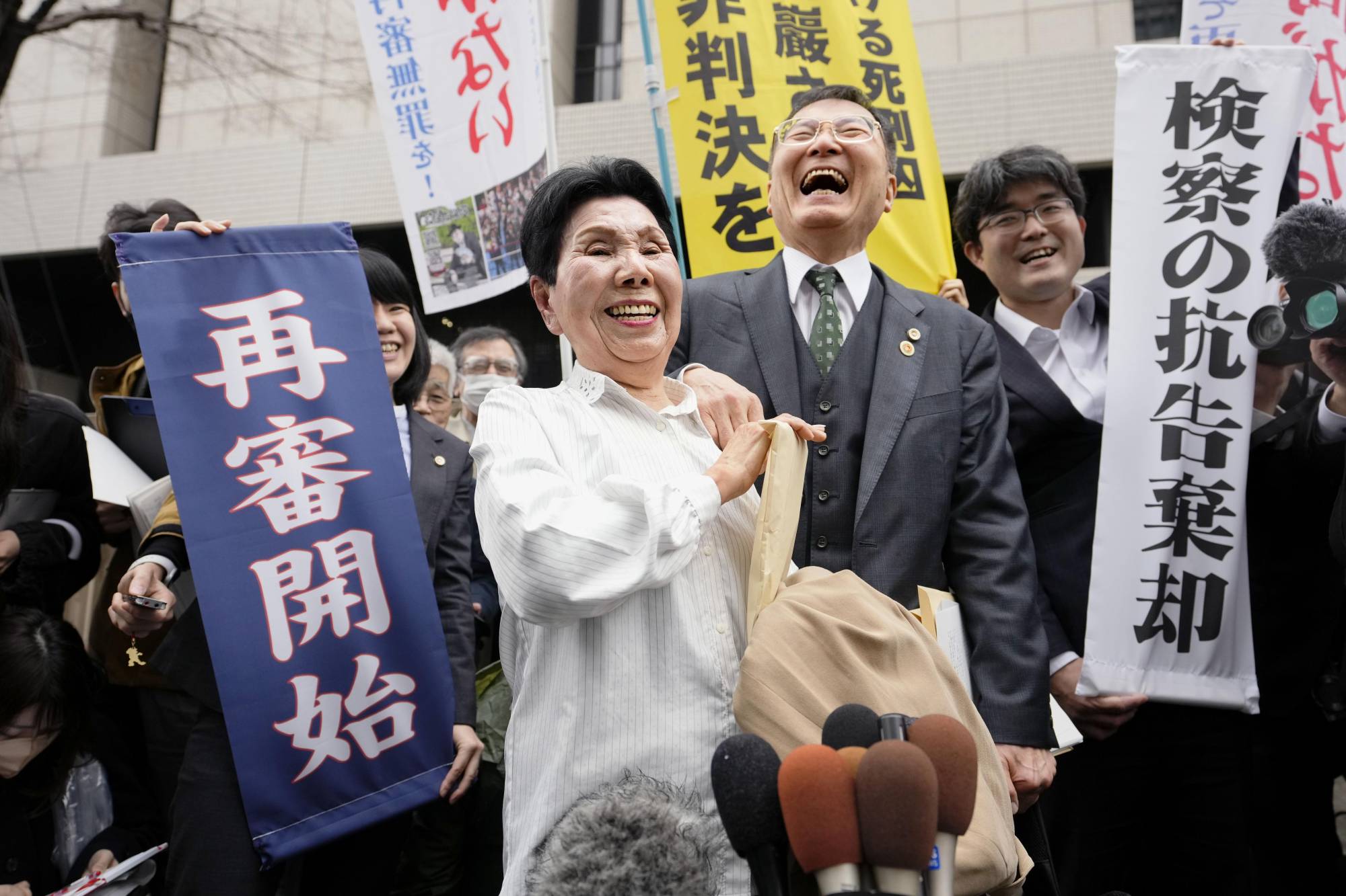 Hideko Hakamata, the elder sister of Iwao Hakamata, reacts Monday after the Tokyo High Court ordered a retrial for her brother nearly six decades after the 1966 murder he was convicted in. | KYODO