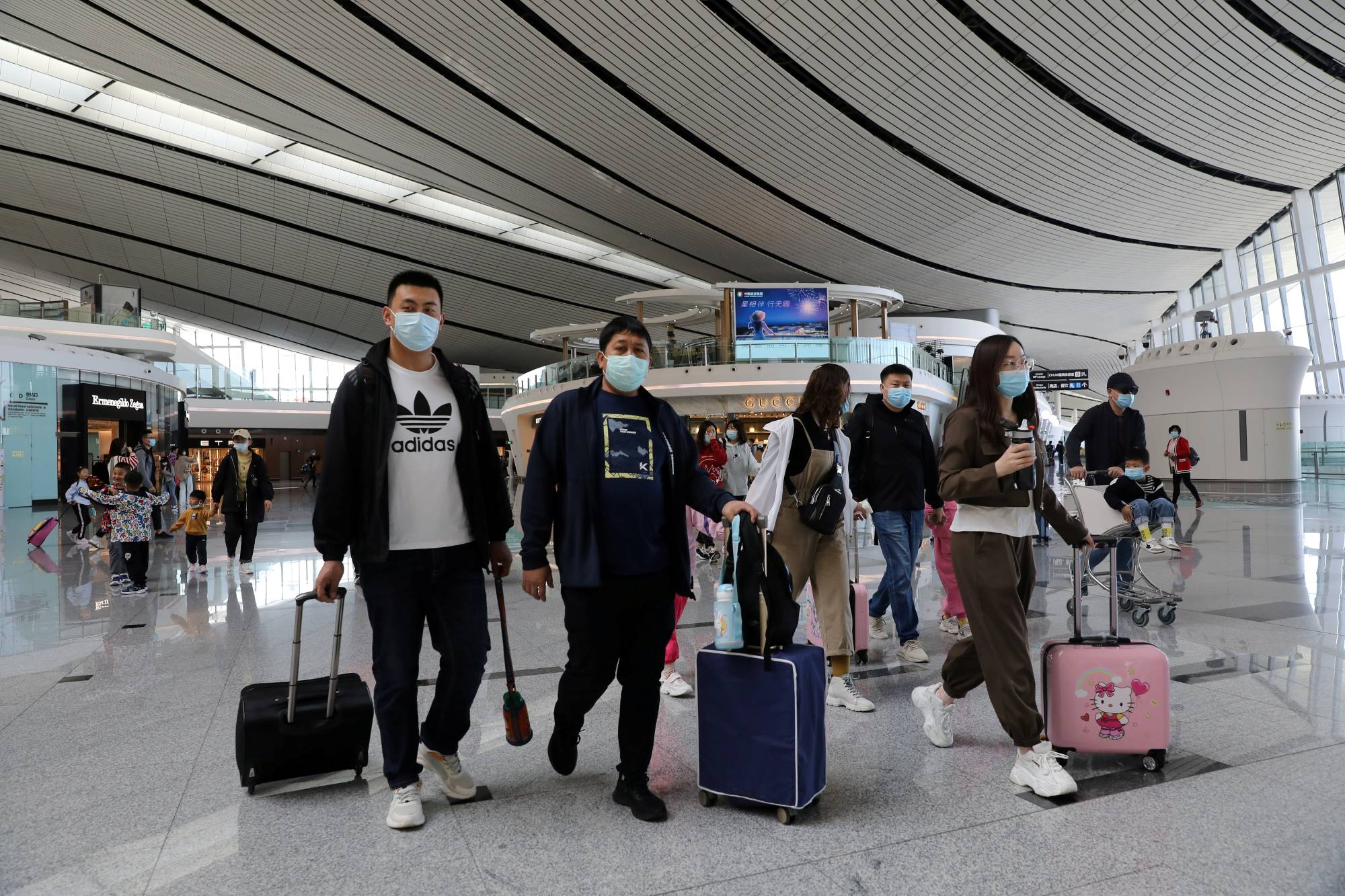Travelers at Beijing Daxing International Airport in Beijing in May 2021 | REUTERS