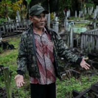 Indigenous Balik tribe leader Sibukdin, 60, visits his tribe\'s cemetery complex at their village, located near Indonesia\'s projected new capital | REUTERS 