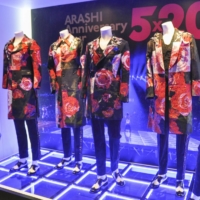 Stage outfits from the five members of Arashi are displayed at a Shanghai store on Wednesday. | KYODO