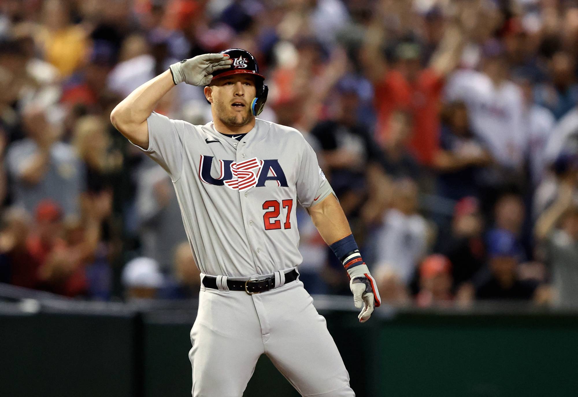 U.S. outfielder Mike Trout celebrates with a salute after hitting a triple in the first inning against Colombia during the World Baseball Classic at Chase Field in Phoenix on Wednesday.  | USA TODAY / VIA REUTERS