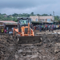 An excavator digs to search for survivors after a mudslide occurred due to heavy rains from cyclone Freddy at Manje informal settlement in Blantyre, southern Malawi, on Thursday. | AFP-JIJI
