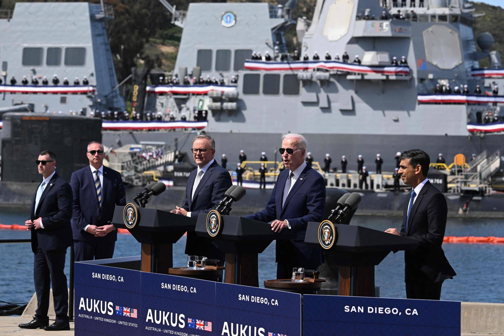 Australian Prime Minister Anthony Albanese, U.S. President Joe Biden and British leader Rishi Sunak speak to reporters about the AUKUS summit at a naval base in San Diego, California, on Monday.  | AFP-JIJI