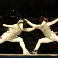 Russia\'s Ianna Ruzavina (left) competes against Carolin Golubytskyi of Germany during a fencing event in 2008. | REUTERS