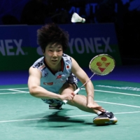 Akane Yamaguchi dives for a return against Chen Yufei during their women\'s singles semifinal at the All England Open Badminton Championships in Birmingham, England, on Saturday. | REUTERS