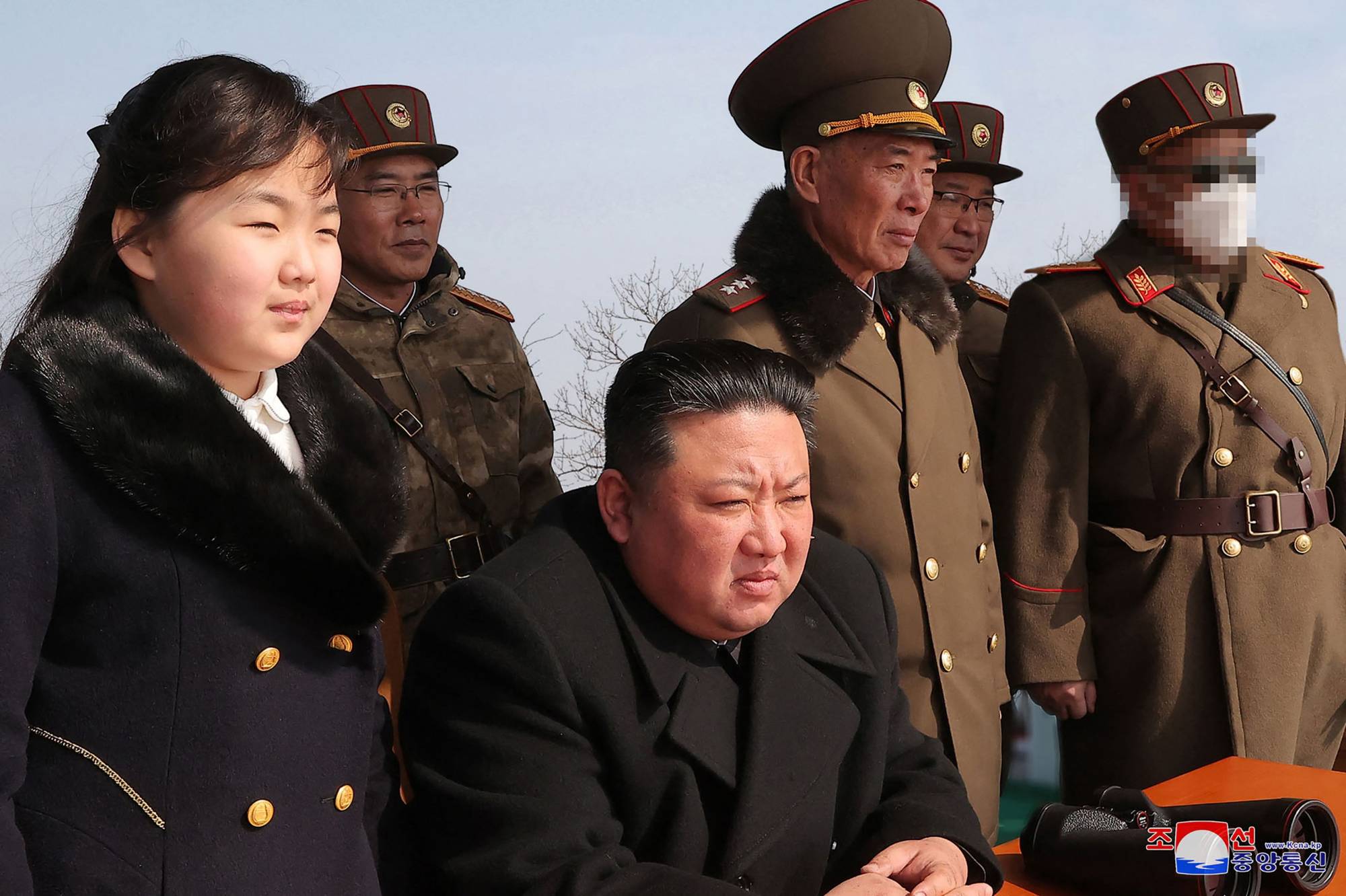 North Korean leader Kim Jong Un and his daughter observe a missile launch exercise simulating a tactical nuclear attack in Cheolsan County, North Pyongan province, in this recent picture released Monday. | KCNA / KNS / VIA AFP-JIJI