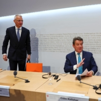 Chairman of the Board of Directors of Credit Suisse Axel Lehmann (left), Chairman of the Board of Directors of UBS Colm Kelleher (center) and Federal Councillor and chief of the finance federal department Karin Keller-Sutter attend a news conference on Credit Suisse after the UBS takeover offer, in Bern, Switzerland, on Sunday. | REUTERS