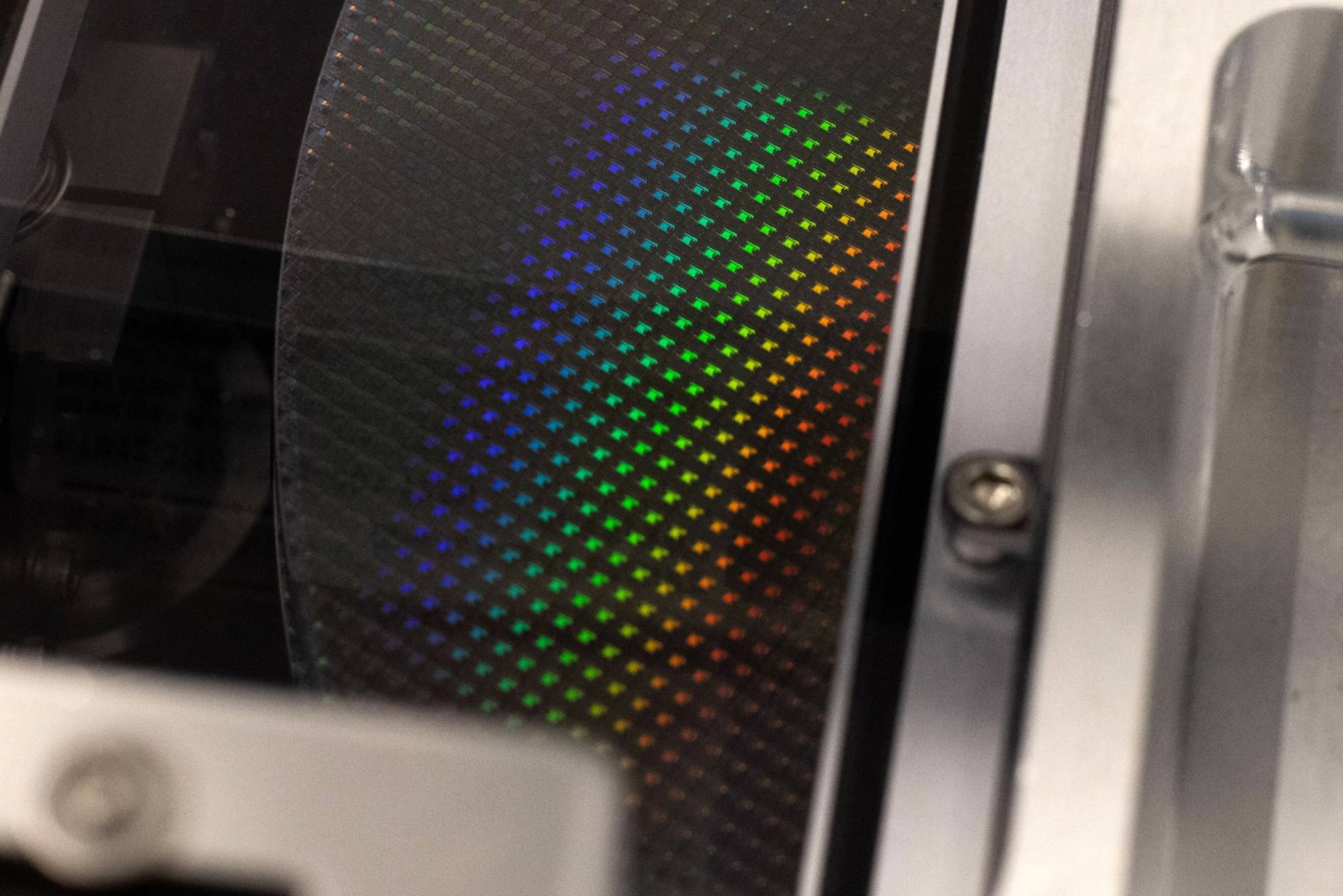 A silicon semiconductor wafer in a clean room. There are manufacturers in Japan, including Valqua, that dominate a niche but indispensable segment of the global chip supply chain. | BLOOMBERG