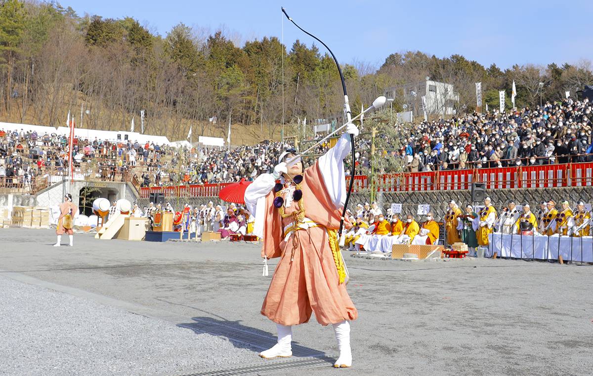 A female archer shoots rubber-tipped arrows as part of the process of spiritual cleansing and renewal.