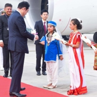 Kishida is greeted by traditionally dressed Indian children upon his arrival at the airport in New Delhi on Monday. | INDIAN PRESS INFORMATION BUREAU / VIA AFP-JIJI