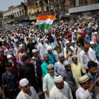 Muslims shout slogans during a protest in Kolkata, India, in June. | REUTERS