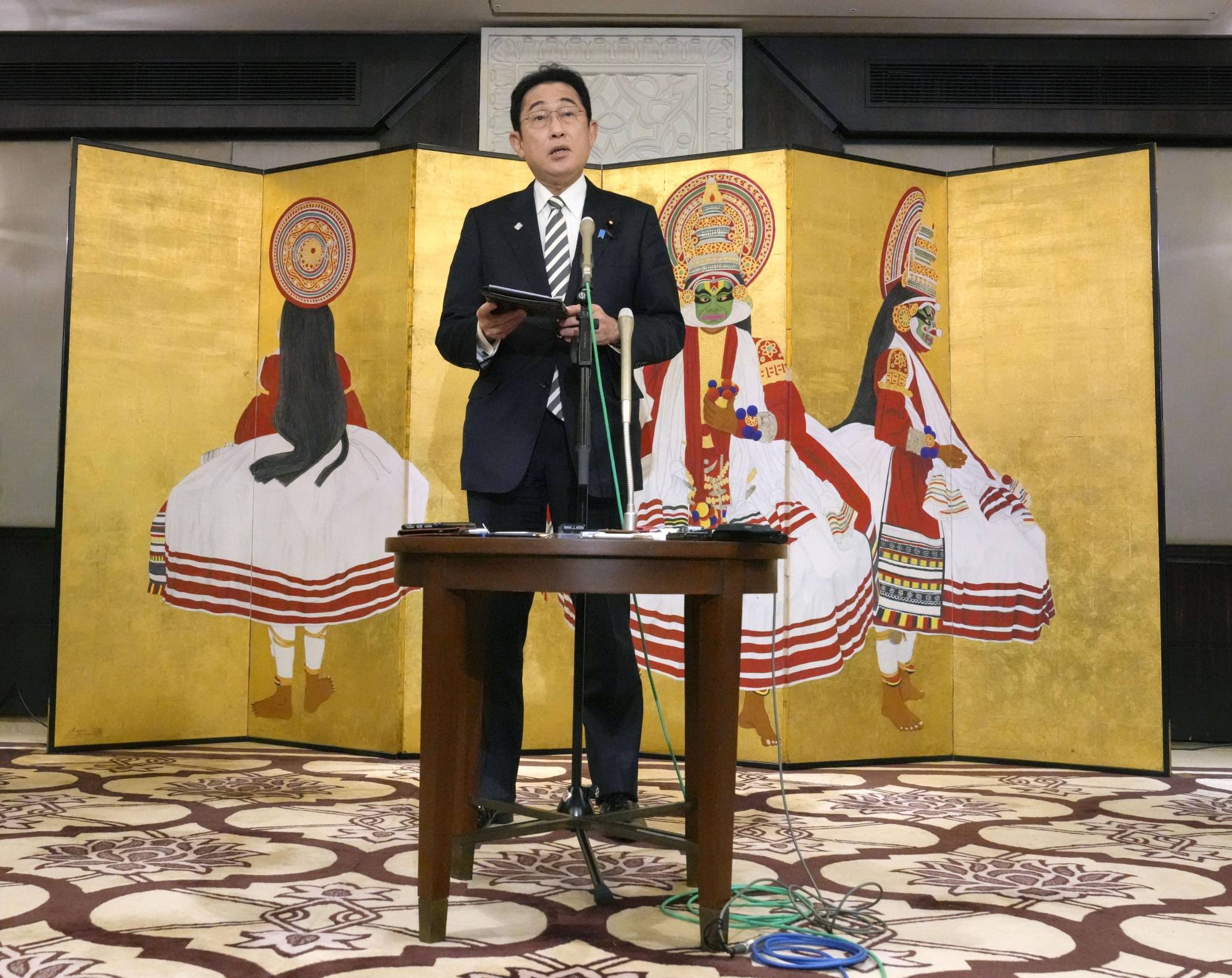 Prime Minister Fumio Kishida speaks to reporters in New Delhi on Monday after holding talks with Indian leader Narendra Modi. | KYODO