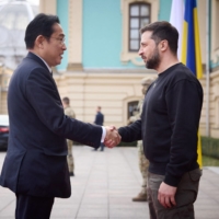 Prime Minister Fumio Kishida is welcomed by Ukrainian President Volodymyr Zelenskyy for a meeting at Mariinsky Palace in Kyiv on Tuesday. | UKRAINIAN PRESIDENTIAL PRESS SERVICE / VIA AFP-JIJI 