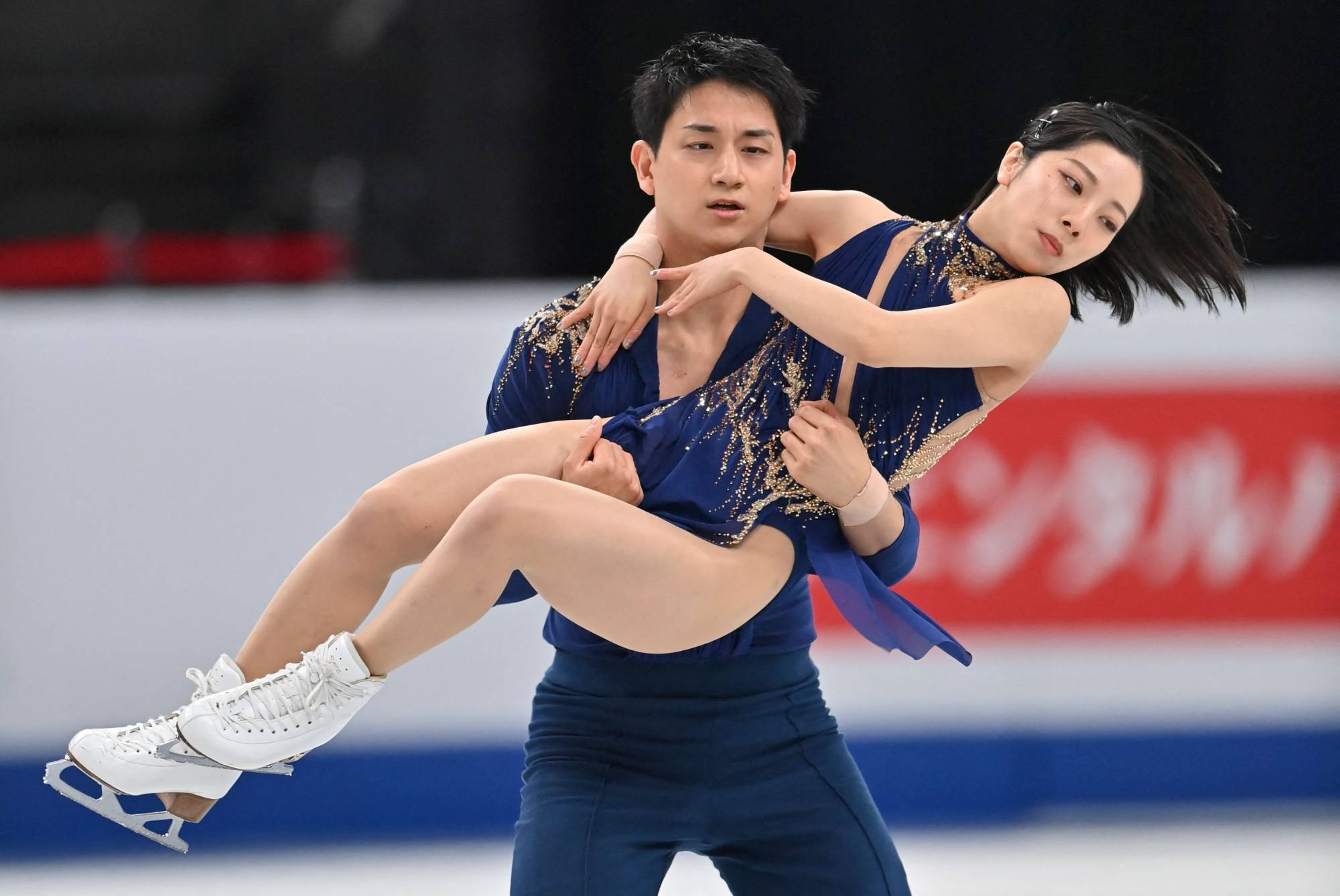 Japan's Riku Miura (right) and Ryuichi Kihara perform in the pairs short program at the ISU World Figure Skating Championships in Saitama on Wednesday. | AFP-Jiji