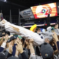 Shohei Ohtani and his teammates celebrate after Japan defeated their American opponents in the final of the World Baseball Classic at LoanDepot Park, in Miami, on Tuesday. 
 | RHONA WISE / USA TODAY SPORTS