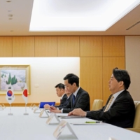 Foreign Minister Yoshimasa Hayashi (front right) and South Korean Unification Minister Kwon Young-se (front left) meet in Tokyo on Thursday. | POOL / VIA KYODO 