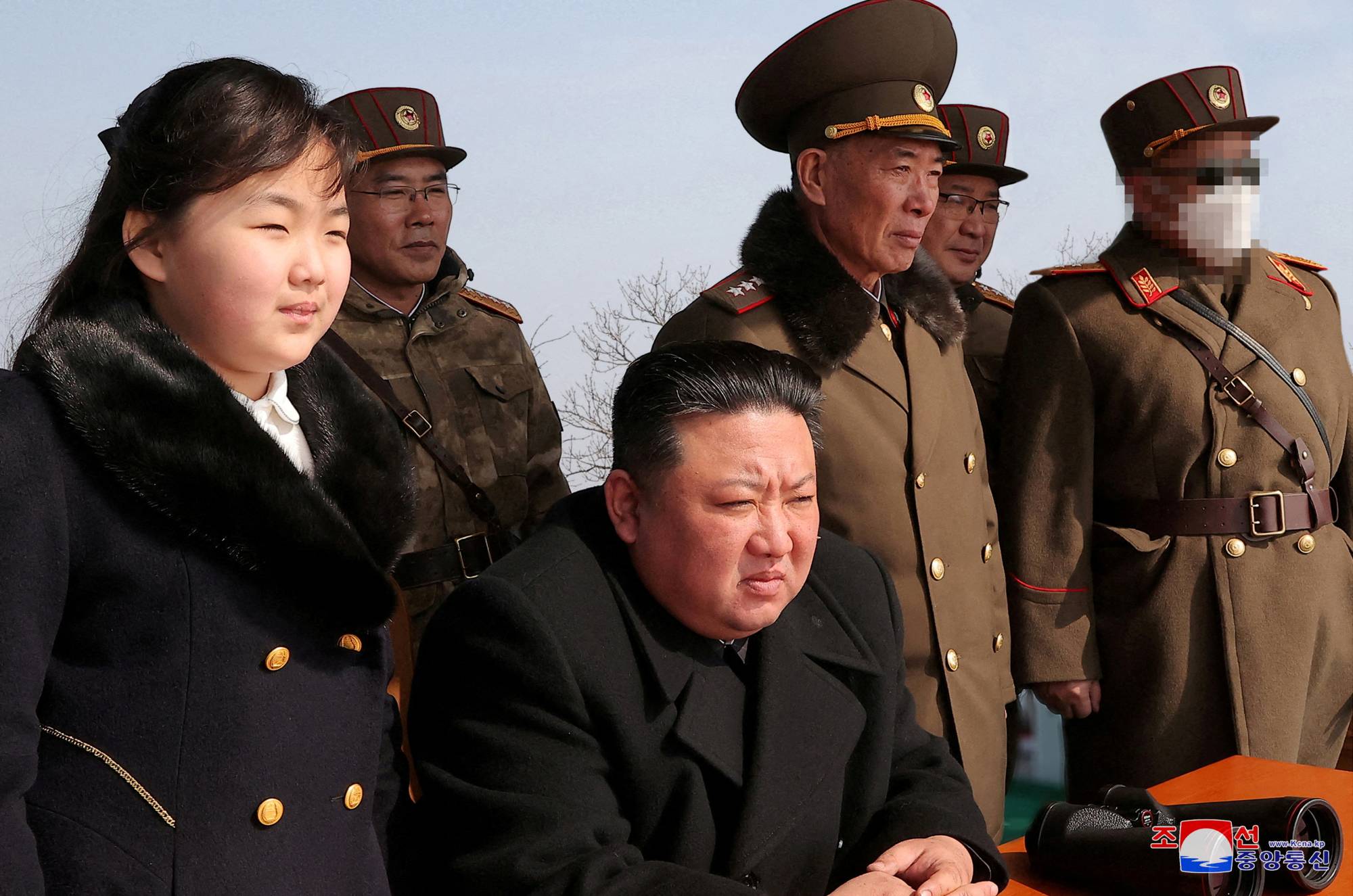 North Korean leader Kim Jong Un and his daughter, Ju Ae, watch a missile drill at an undisclosed location in this image released on Monday. | KCNA / VIA REUTERS  
