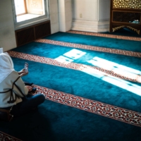 Two women check their smartphone while relaxing at Tokyo Camii. Experts suggest reaching out to people when you start to feel homesickness around religious occasions such as Ramadan.  | JOHAN BROOKS
