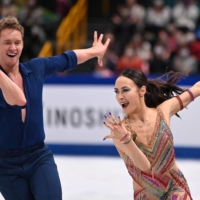 American ice dancers Evan Bates (left) and Madison Chock, seen competing at the world championships in Saitama on Friday, are among several Team USA skaters who did not receive their medals after the team competition at the 2022 Beijing Winter Olympics. | AFP-JIJI