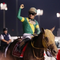 Jockey Yuga Kawada celebrates atop Ushba Tesoro after winning the Dubai World Cup race at Meydan Racecourse on Saturday. | REUTERS