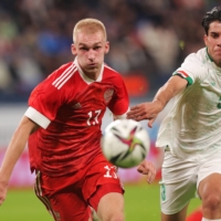 Russia\'s Danil Denisov (right) and Iraq\'s Hasan Raed vie for the ball during their friendly in St. Petersburg, Russia, on Sunday. | REUTERS