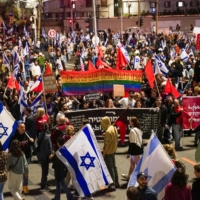Protesters attend a demonstration against Israeli Prime Minister Benjamin Netanyahu and his nationalist coalition government\'s plan for judicial overhaul, in Tel Aviv, on Monday | REUTERS