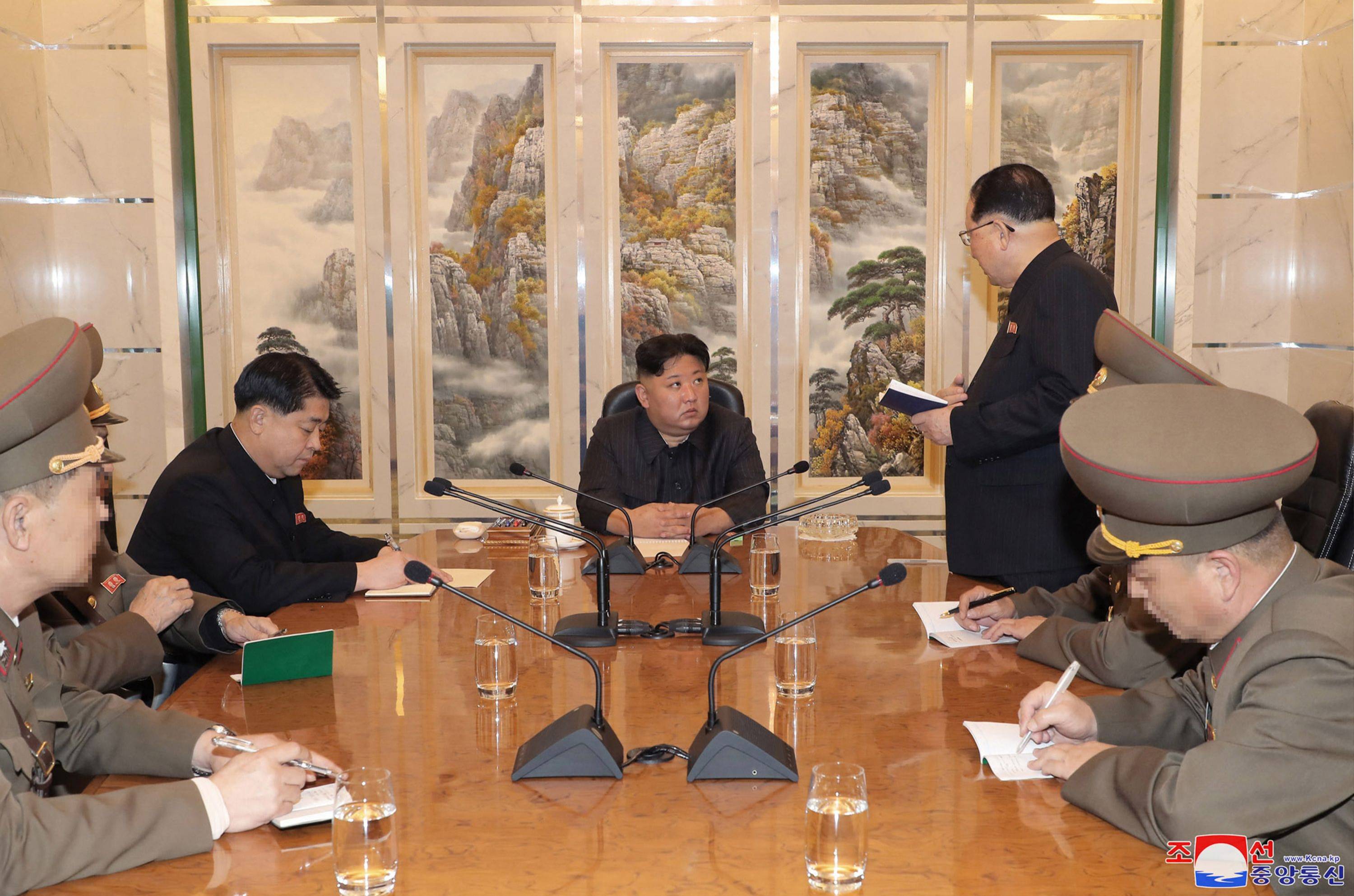 Kim meets with officials at an undisclosed location in the country, in this image released Tuesday. | KCNA / KNS / VIA AFP-JIJI 