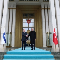 Turkish President Recep Tayyip Erdogan and Finnish President Sauli Niinisto shake hands during a welcoming ceremony in Ankara on March 17. | PRESIDENTIAL PRESS OFFICE / VIA REUTERS
