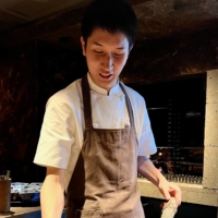 Chef Yu Kunisue’s hallmark at Shizen is cooking on an open wood fire. | ROBBIE SWINNERTON
