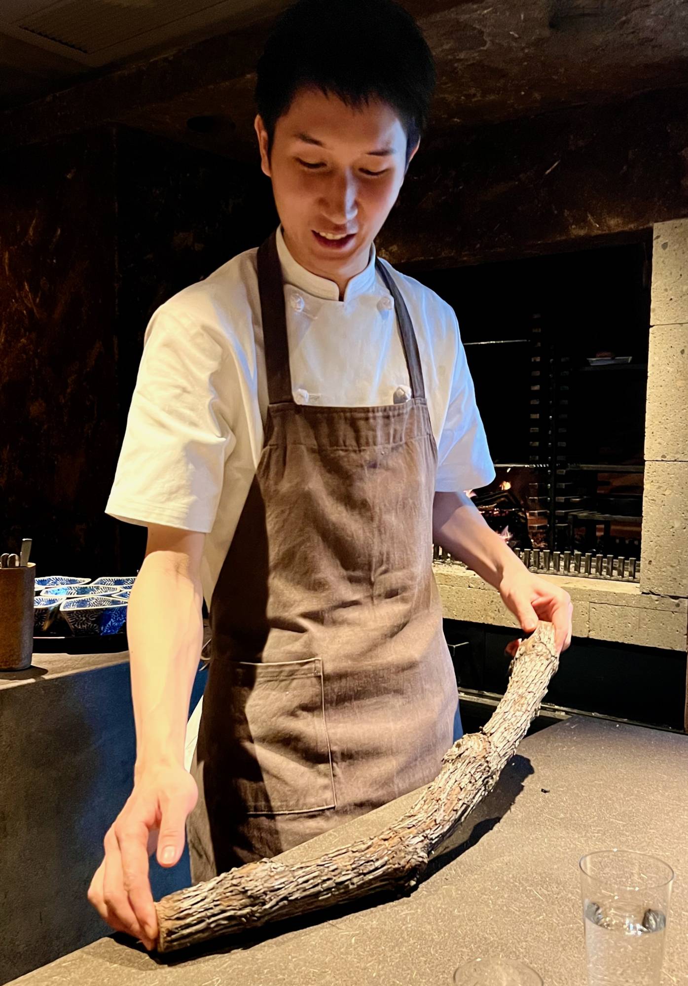 Chef Yu Kunisue’s hallmark at Shizen is cooking on an open wood fire. | ROBBIE SWINNERTON 